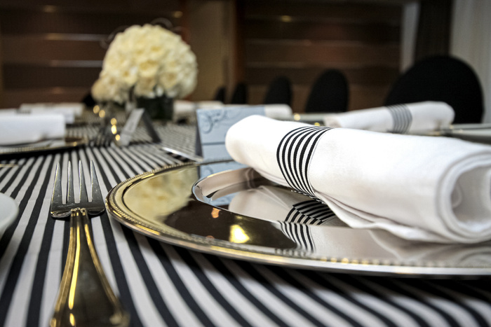 Table setting in black and white for gala dinner or corporate party